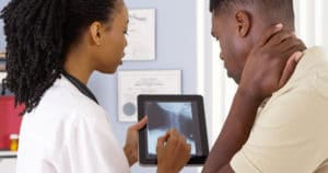 doctor and patient looking at x-ray